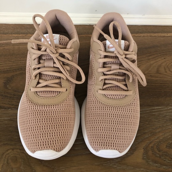 nude color tennis shoes